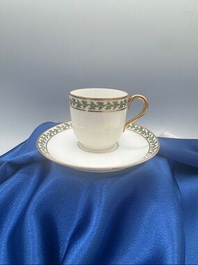 Limoges White Porcelain Demitasse Cup & Saucer with Green Vine and Gold Trim.